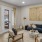 Model living room at our senior living community in Farmington, UT, featuring large windows and doors to the balcony.